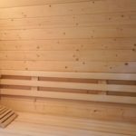 Wooden back rests in sauna room